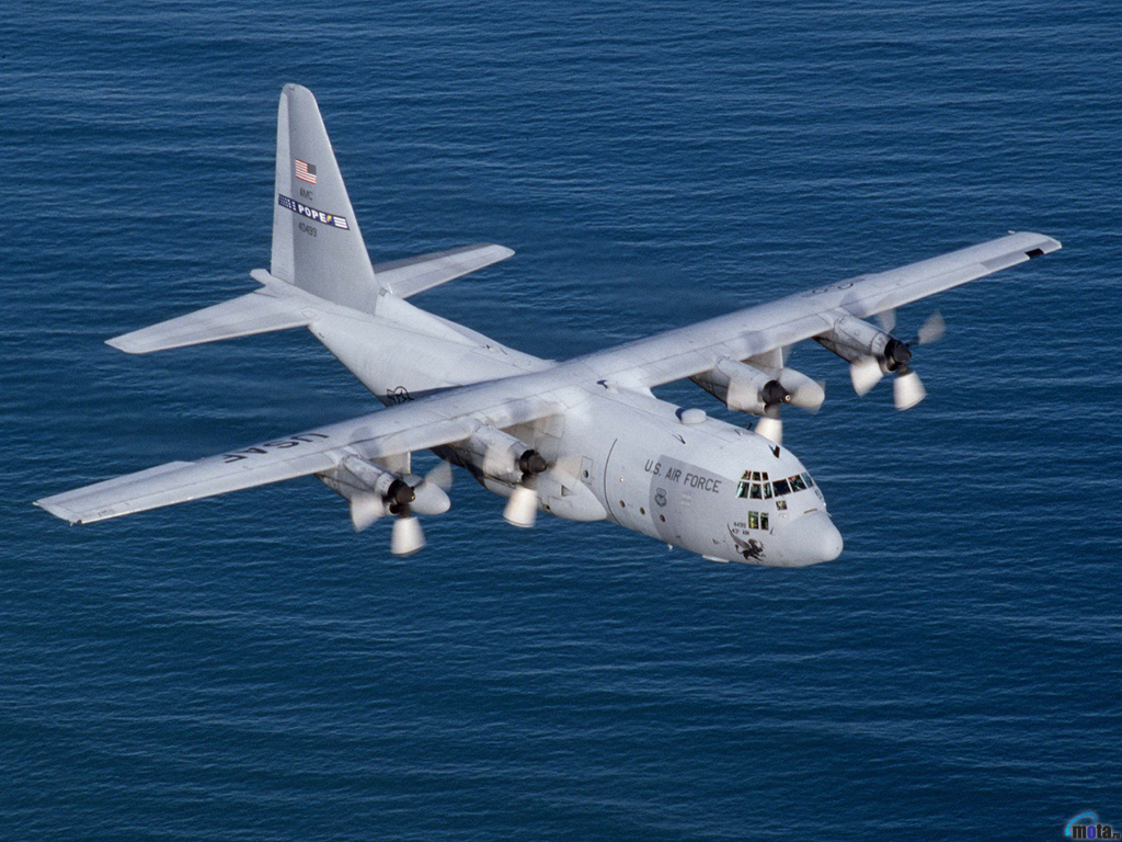 378.jpg - A C-130E from the 2nd Airlift Squadron, Pope AFB, NC.  Flies over the Atlantic Ocean.