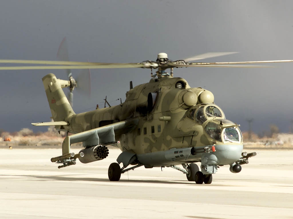 436.jpg - A Hind Mi-24 helicopter from the Army Test and Evaluation Center, Threat Support Activity, Las Vegas, Nev., taxis back after providing simulated hostile threats to Search and Rescue operations during Desert Rescue on Feb. 17, 2000.  Desert Rescue is a Joint Service Combat Search and Rescue (CSAR) exercise designed to fully integrate planning and execution of both immediate and dedicated missions.  (U.S. Air Force photo by Master Sgt. Steven M. Turner) (RELEASED)