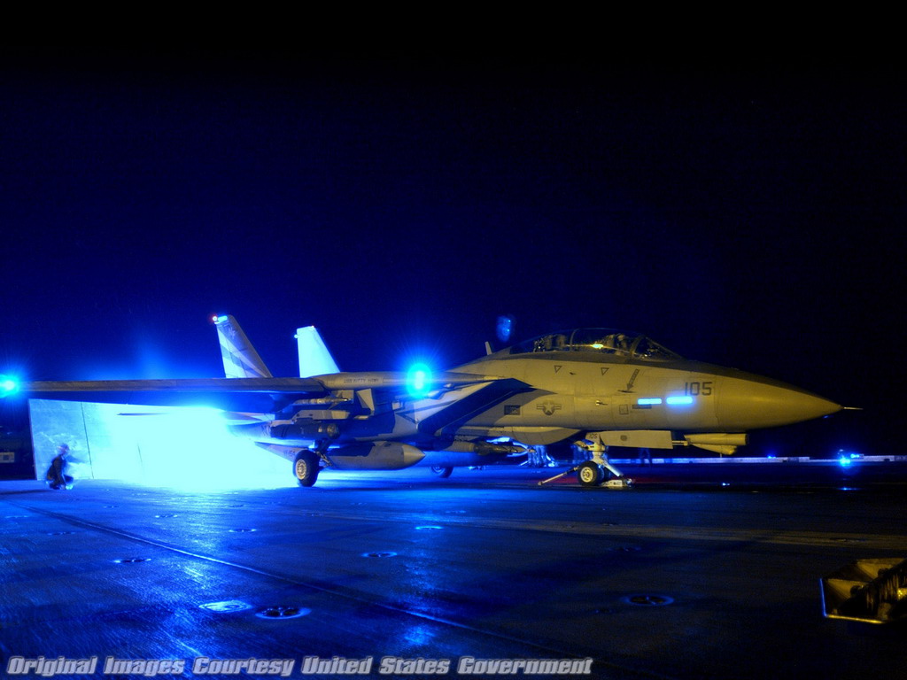 600.jpg - 030330-N-1810F-014The Arabian Gulf (Mar. 30, 2003) -- An F-14A Tomcat ignites its afterburners just prior to launching off the flight deck aboard USS Kitty Hawk (CV 63).  Kitty Hawk and her embarked Carrier Air Wing Five (CVW-5) are conducting combat missions in support of Operation Iraqi Freedom.  Operation Iraqi Freedom is the multi-national coalition effort to liberate the Iraqi people, eliminate Iraq's weapons of mass destruction, and end the regime of Saddam Hussein.  U.S. Navy photo by Photographer's Mate 3rd Class Todd Frantom.  (RELEASED)